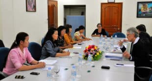 Photo of people meeting around table